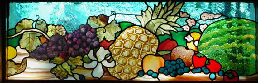 photo of stained glass with pineapple and cornucopia of fruit