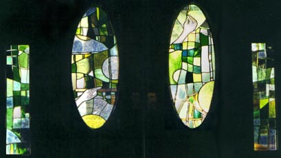 a set of entryway leaded glass windows designed for a weaver